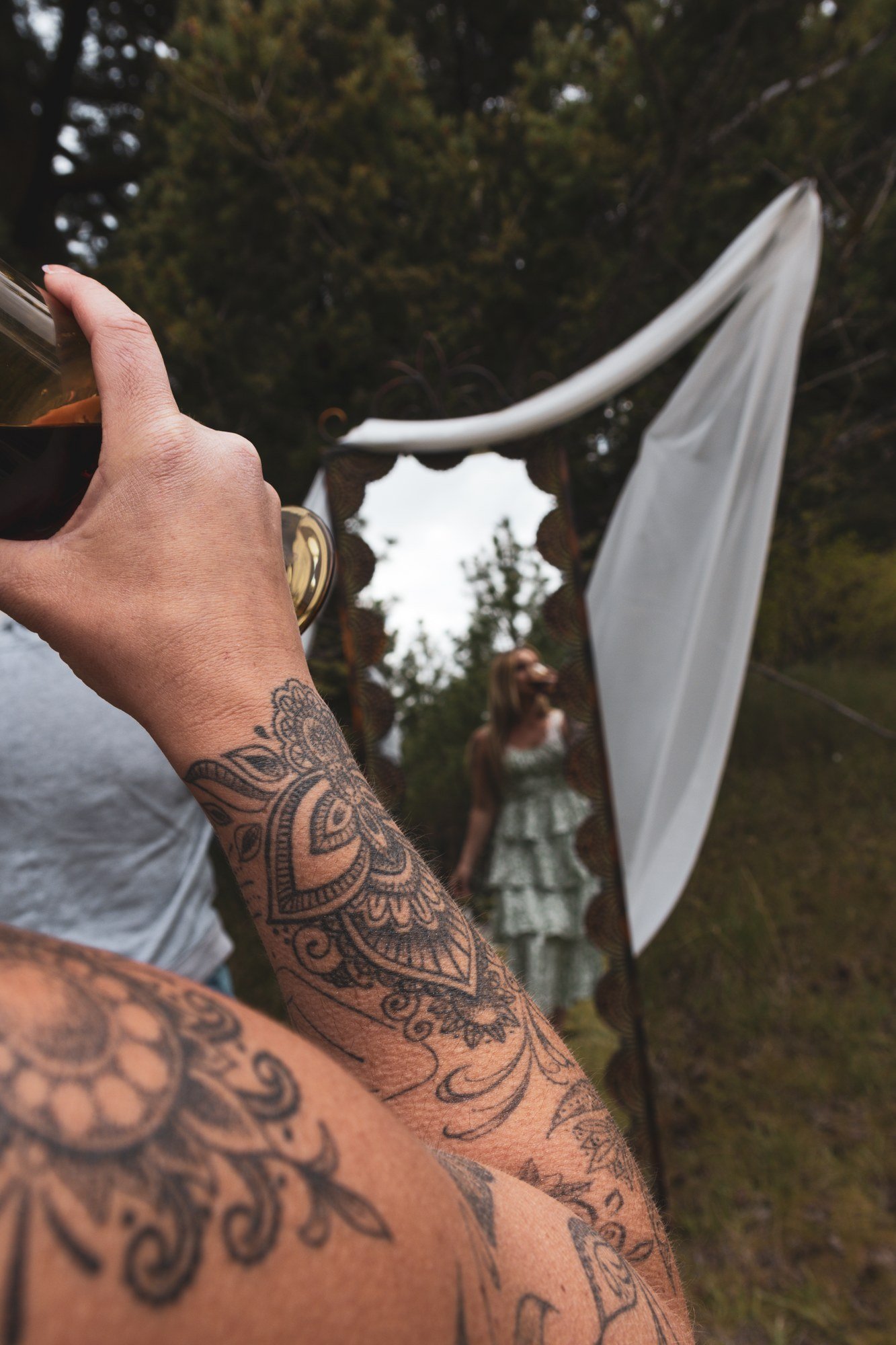 An outdoor mirror portrait setup with draped fabric