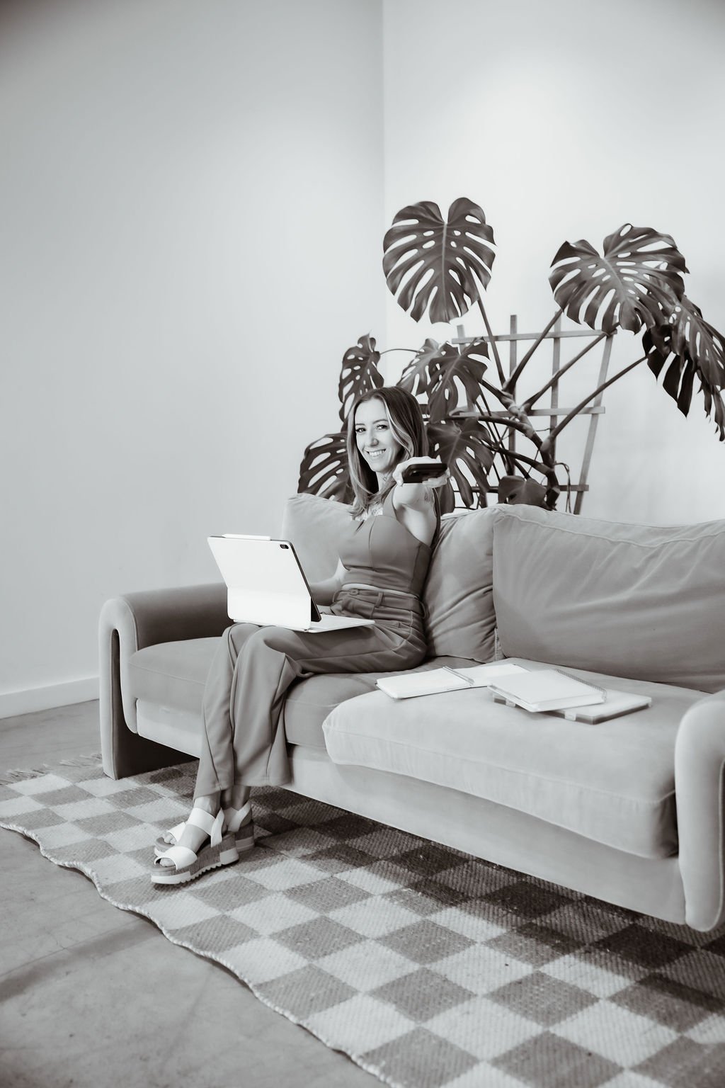 Nicole working with a tablet on a couch